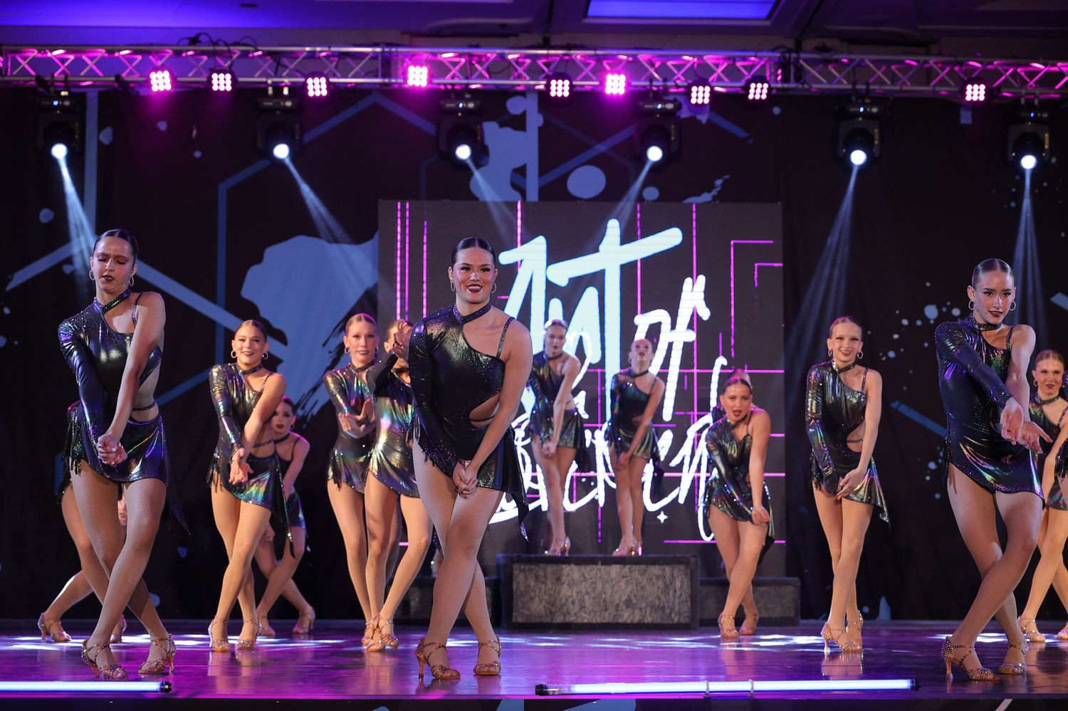 A Project Dance competition team performing on stage